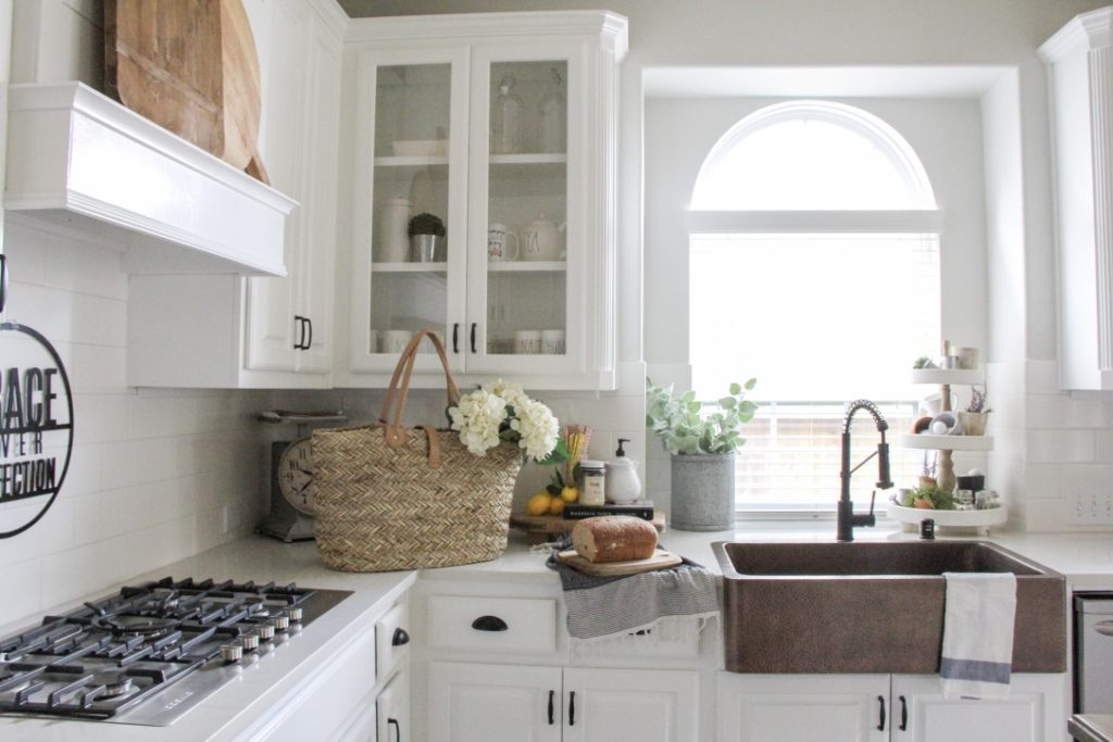 white farmhouse kitchen painted in modern farmhouse paint color intense white by benjamin morre