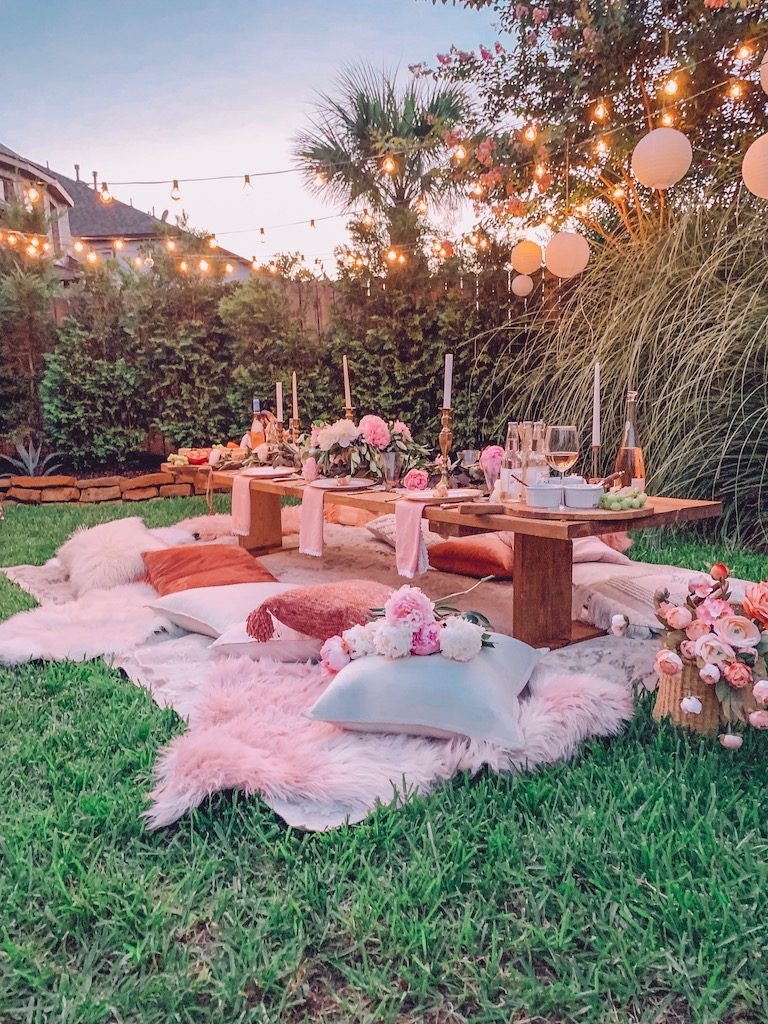 outdoor summer party with pillows for seating