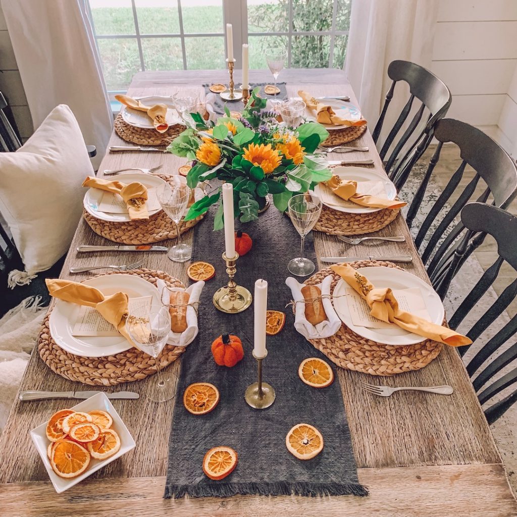 tablescape with dried oranges and mustard yellow