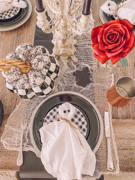 halloween table setting with ghost napkins