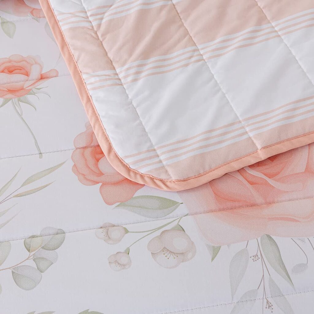 Reversible pink quilt for girls with stripes and floral pattern