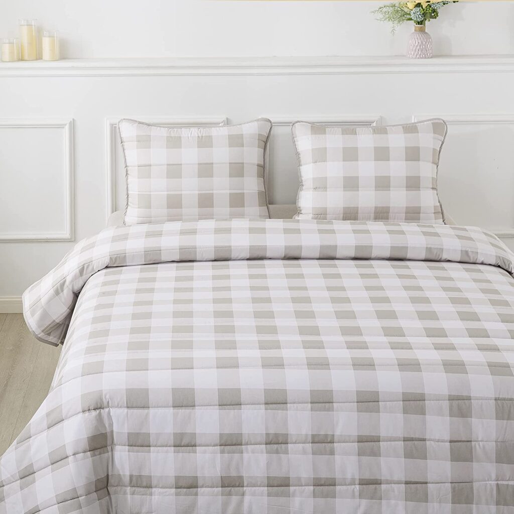 Plaid quilt pattern in neutral taupe color with reversible side