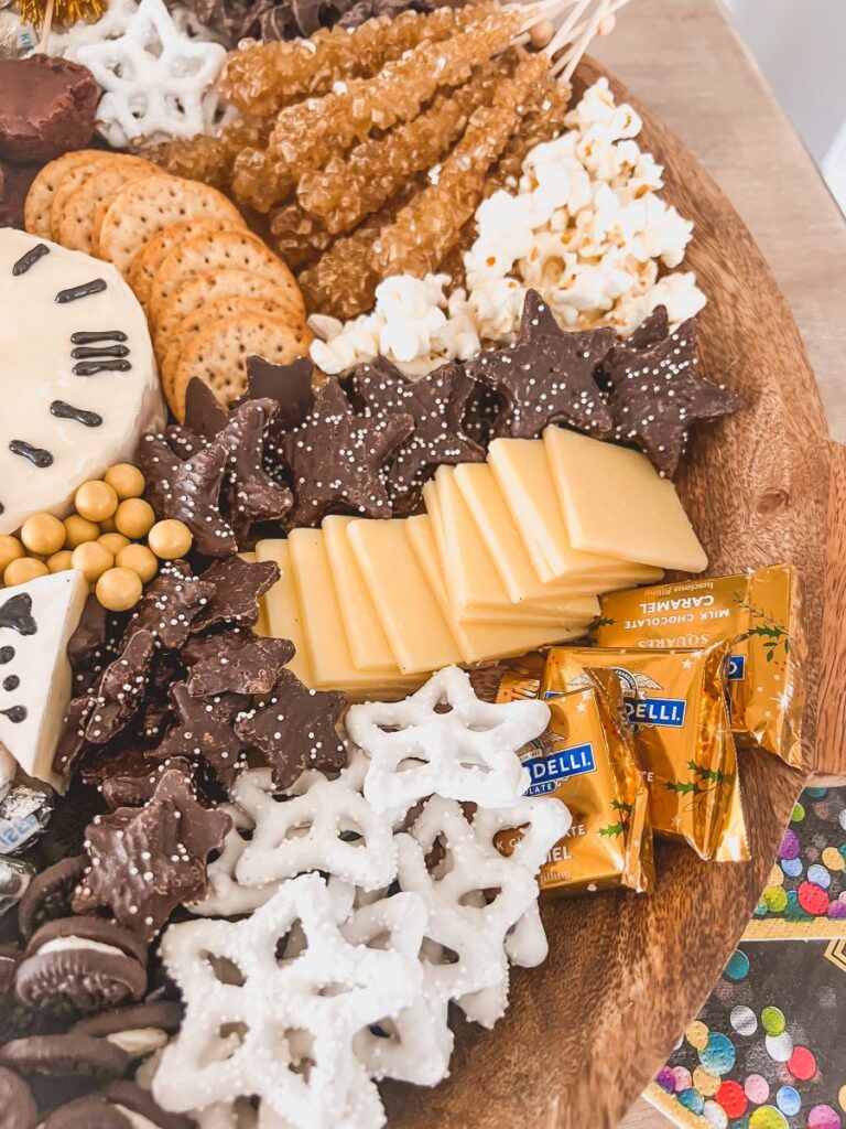 Chocolate stars, cheese, and crackers on a tray