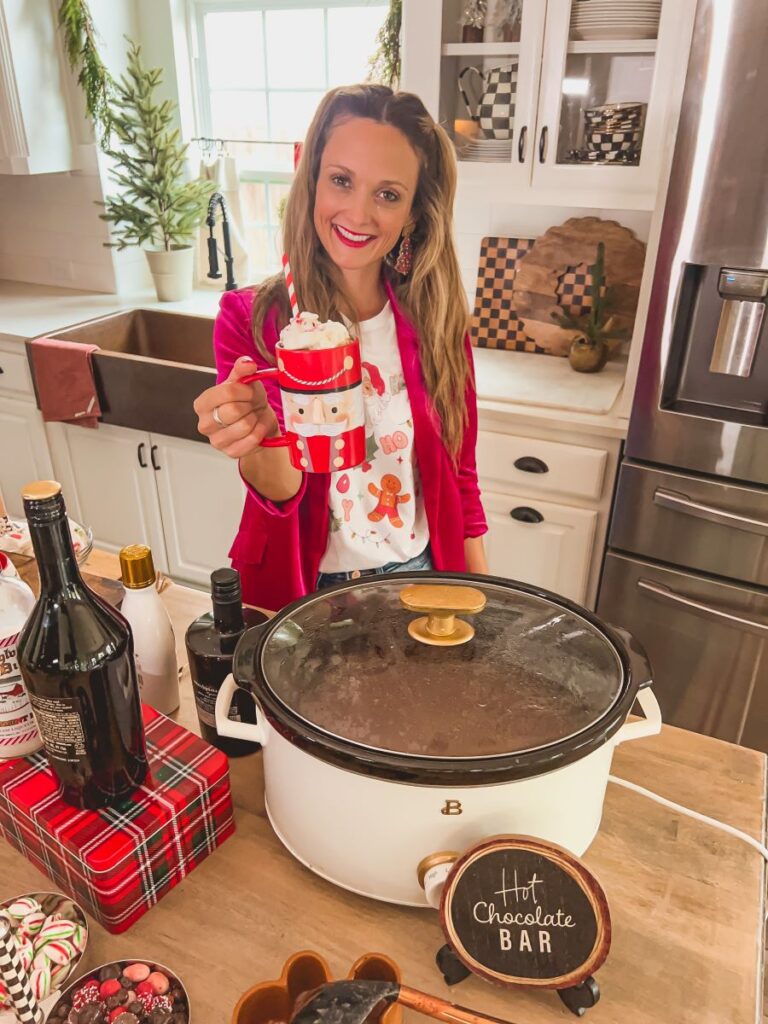 Leanna in front of hot chocolate crock pot