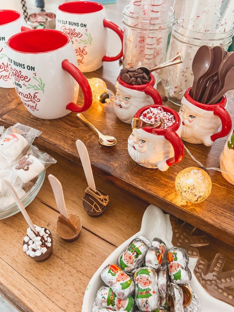 Santa mugs with candy at hot chocolate bar