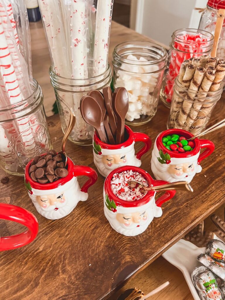 Festive hot chocolate bar with candy in Santa Mugs