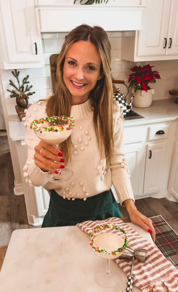 Leanna holding a sugar cookie martini with decorated glass