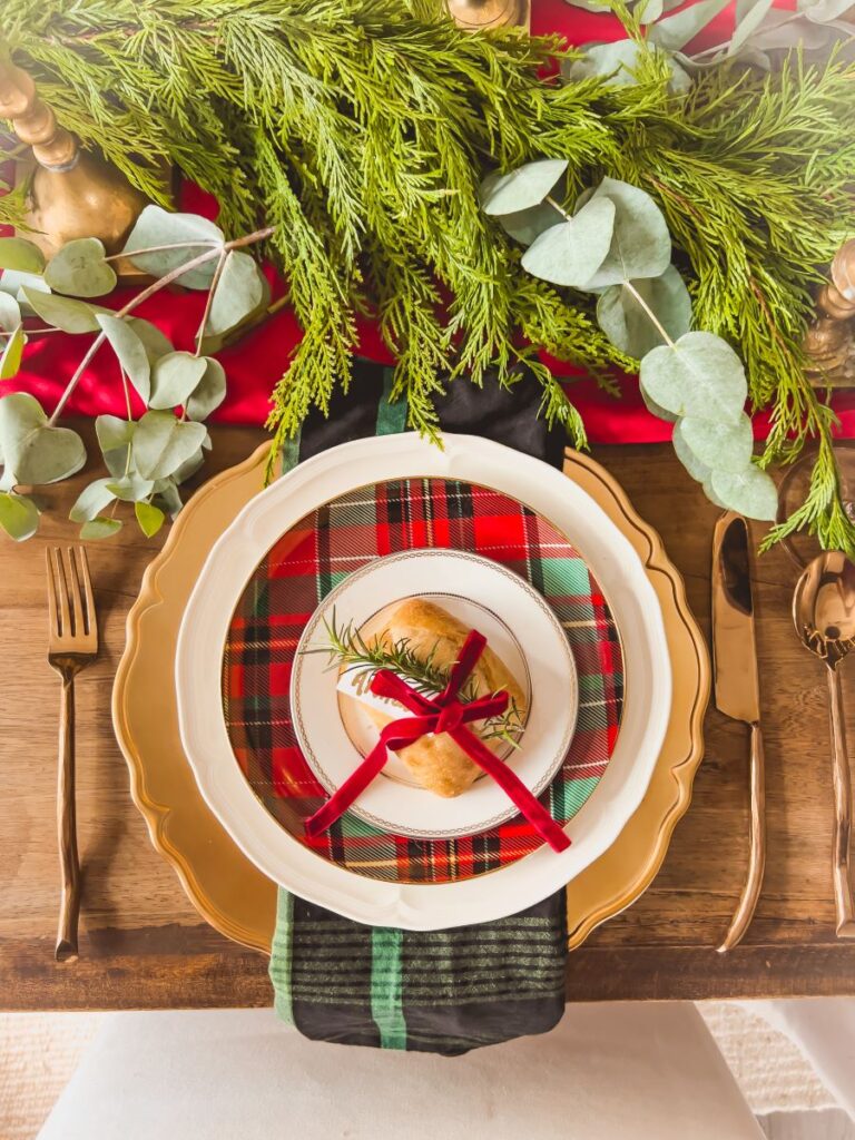 Gold flatware looks stunning next to a Christmas placesetting