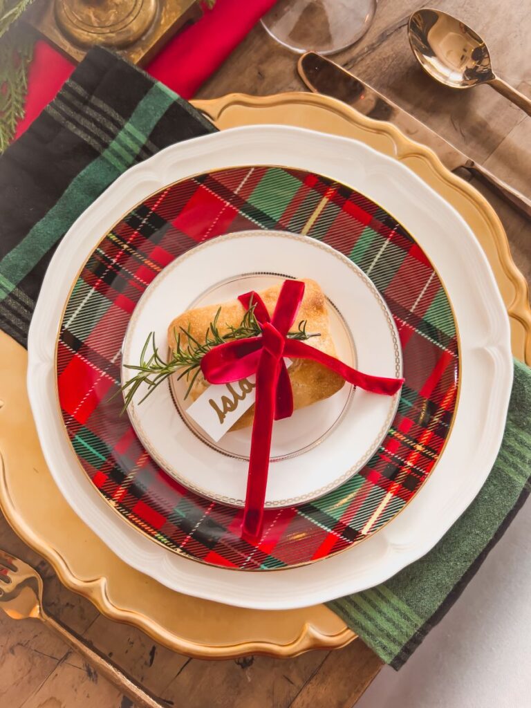 Plaid Plates over a gold charger for a Christmas table