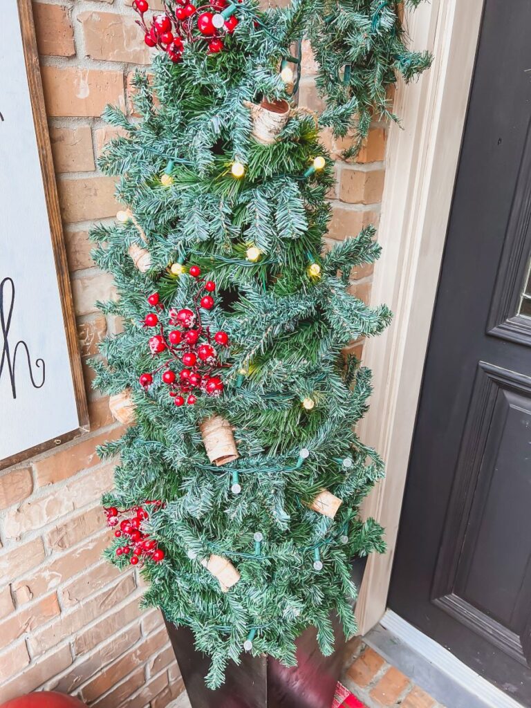 Tree Decoration made from a tomato cage and garland