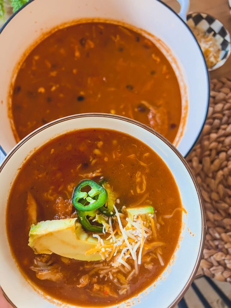 Chicken Enchilada soup with avocado topping