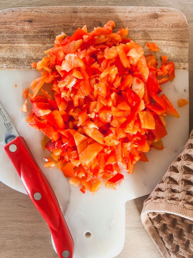 Chopping board with diced vegetables