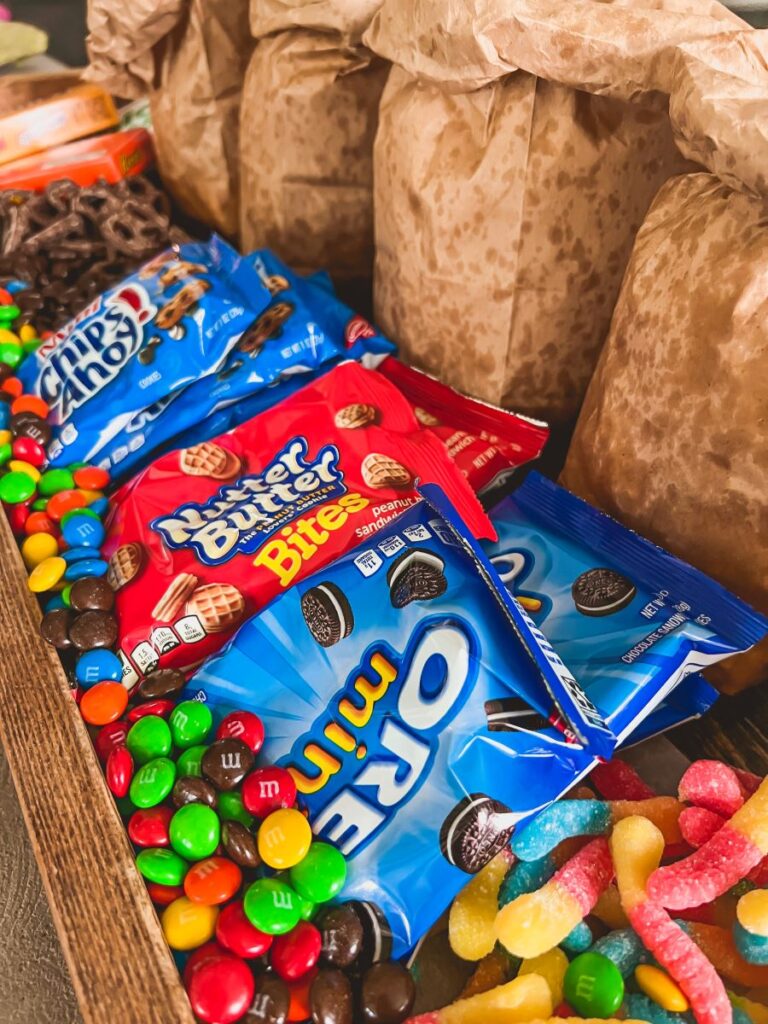 Candy and cookies on a wooden board