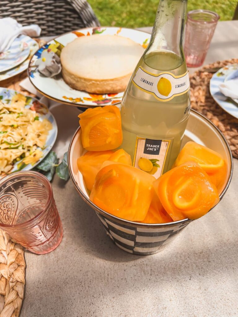 Orange peels in a rose shape frozen in an ice cube