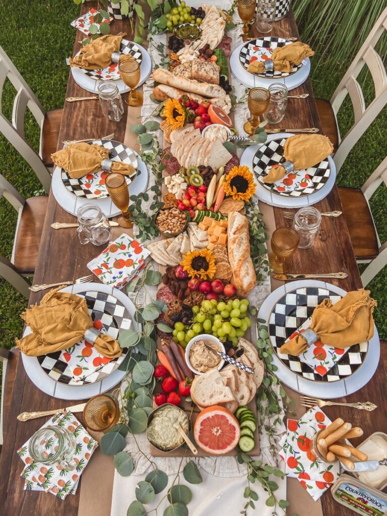 Cute outdoor table with checkered plates and sunflower details