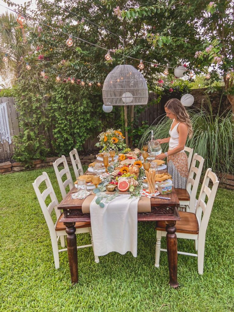 Leanna setting an outdoor table