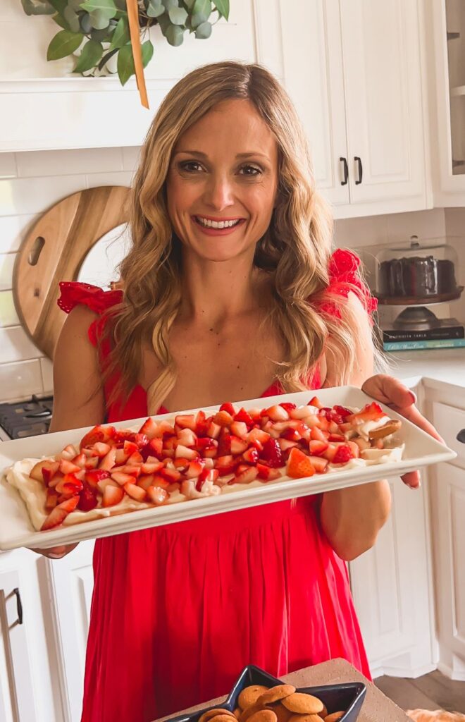 Leanna holding a platter of Strawberry Shortcake Dip