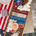 Red, white, and blue serving board with treats and fruit