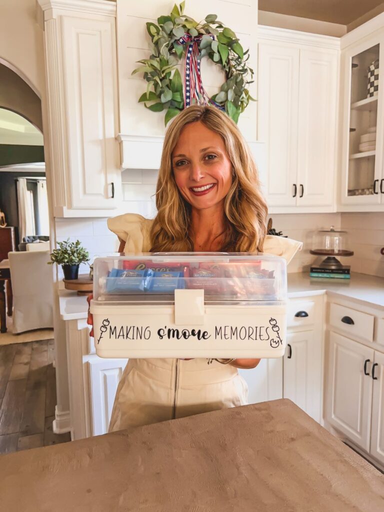 Leanna holding a S'mores tackle box