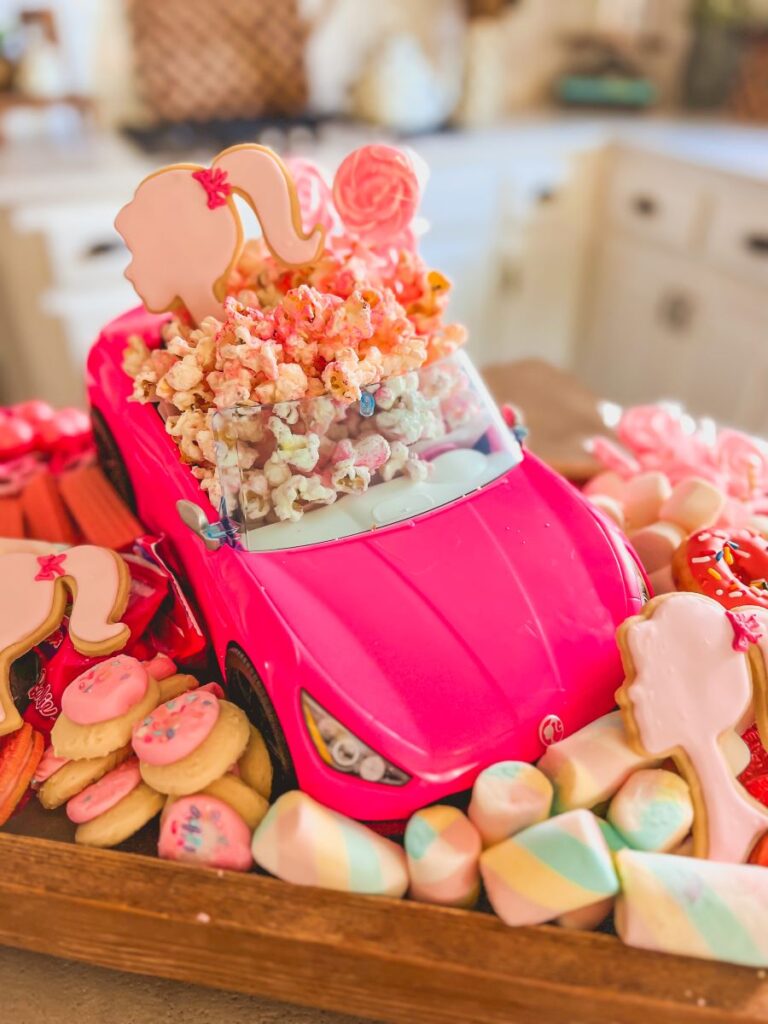 Pink toy car on a Barbie Snack Board