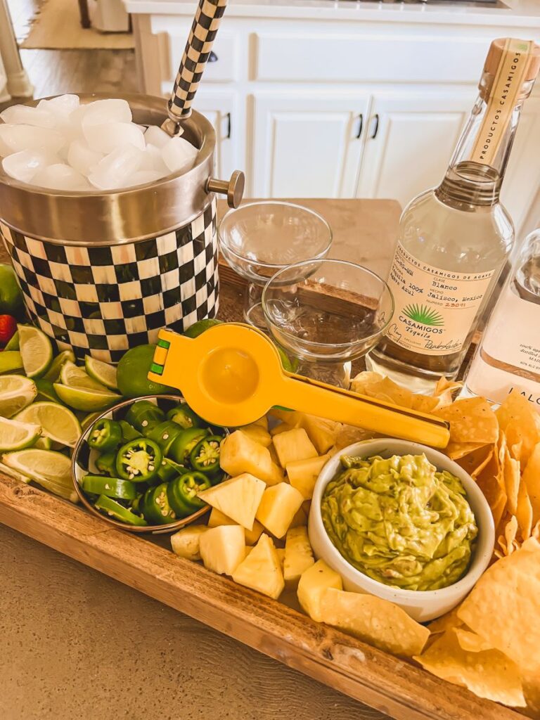 Limes and Lime squeezer on a Margarita Board