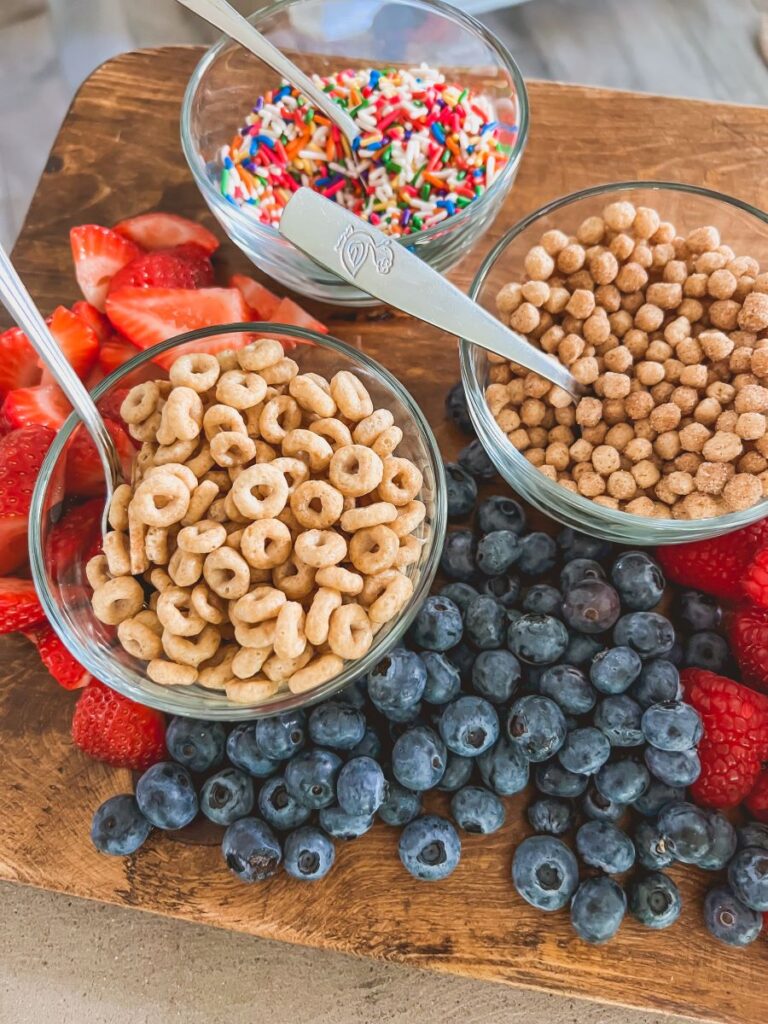 Cereal in glass bowls for a breakfast sundae bar