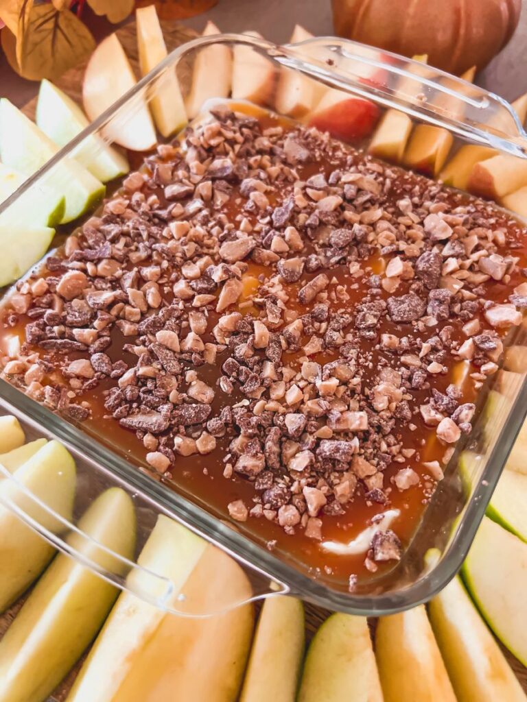 Cream Cheese Caramel Apple Dip surrounded by Apple Slices