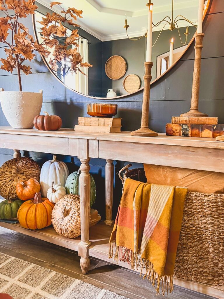 Console table sprinkled with fall decor