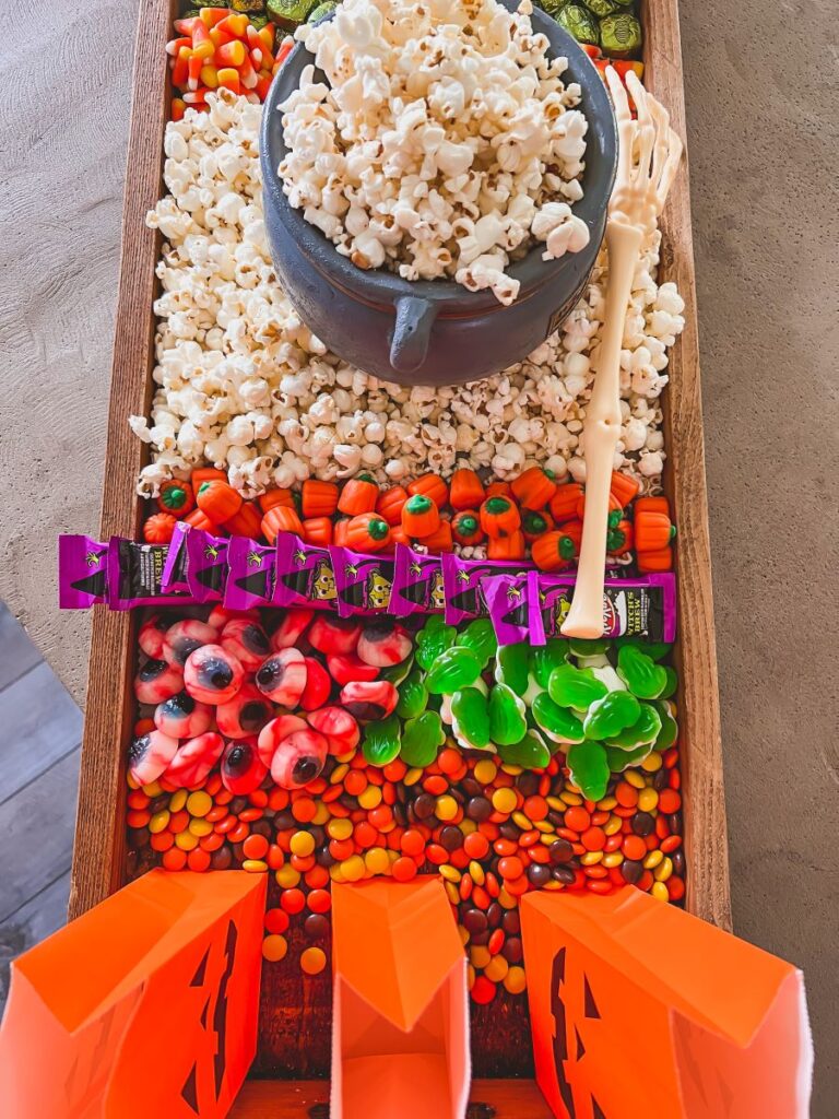 Popcorn and candy on a movie night board