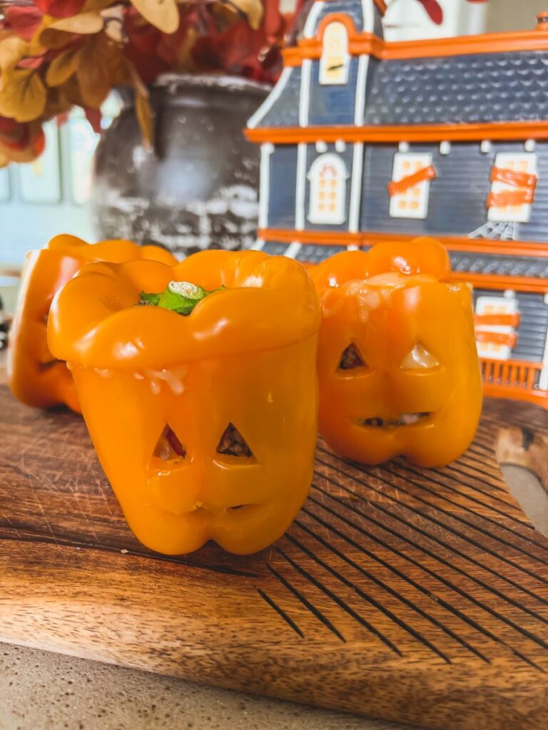 Adorable Jack-O'-Lantern in front of a Haunted House cookie jar