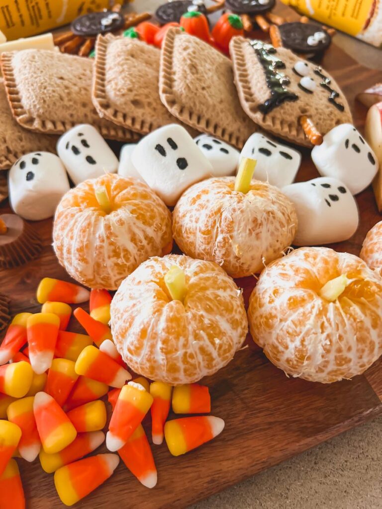 Mandarin oranges decorated as pumpkins