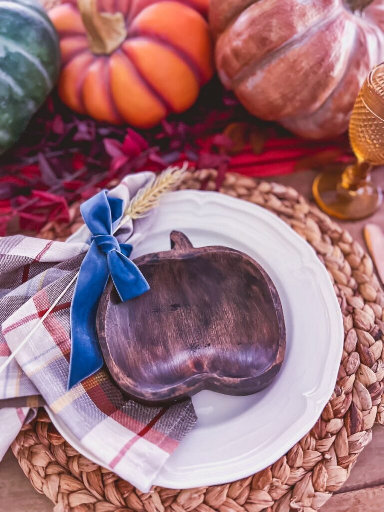 Close-up of a place setting on a fall-themed table