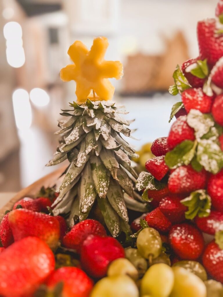 Pineapple leaves sprinkled with powdered sugar to resemble a Christmas tree