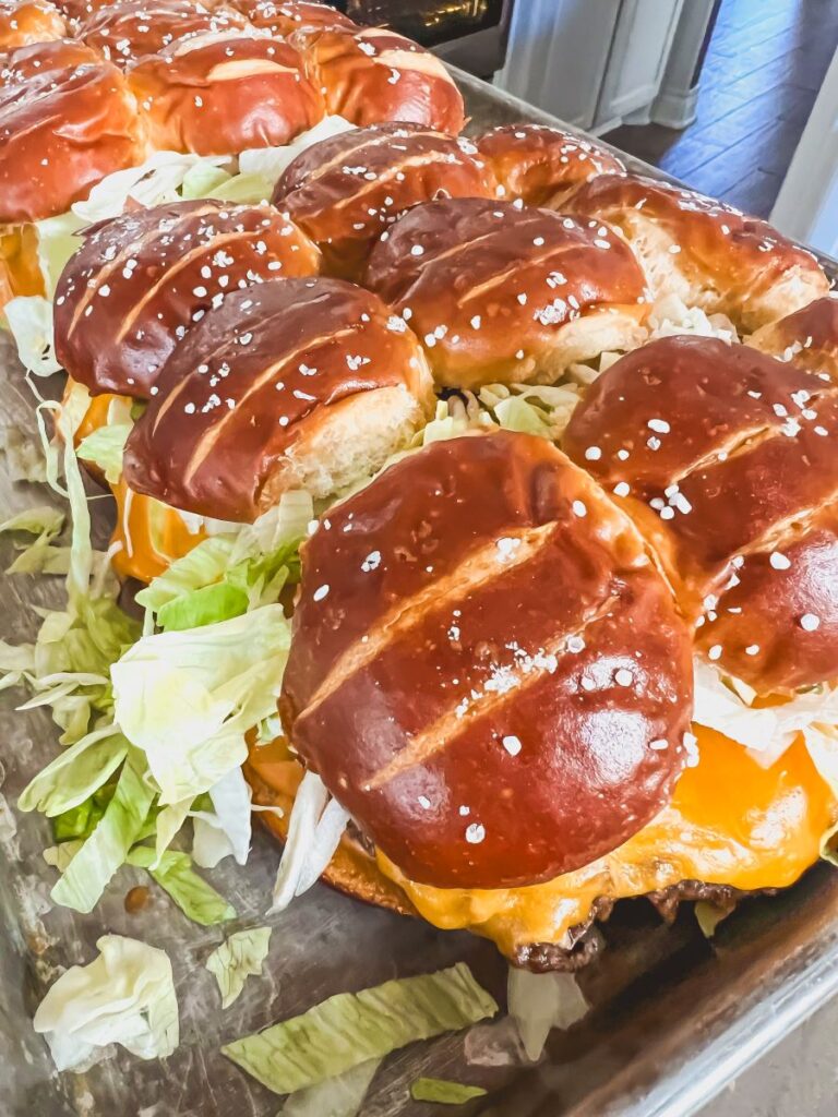 Big Mac Pretzel Sliders on a baking sheet