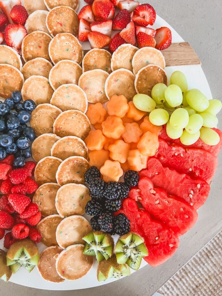 Fruit arranged around a pancake cross shape