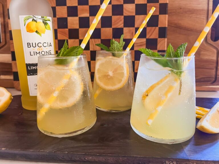 3 Limoncelle Spritz cocktails garnished with lemon and yellow straws