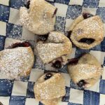 Blueberry Cheesecake Croissants on a blue and white checkered plate