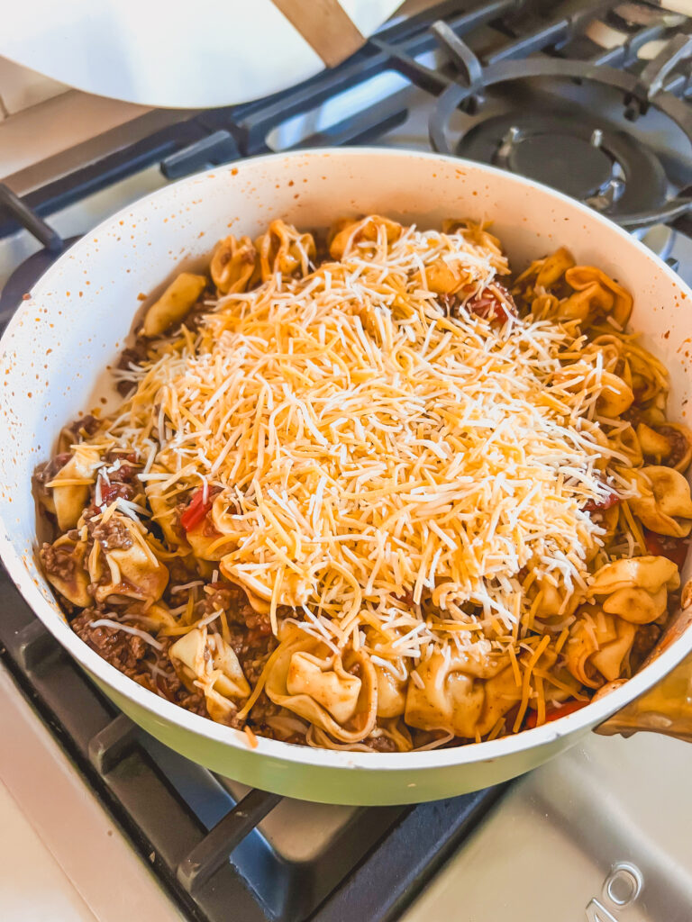 Taco meat and Tortellini in a white bowl