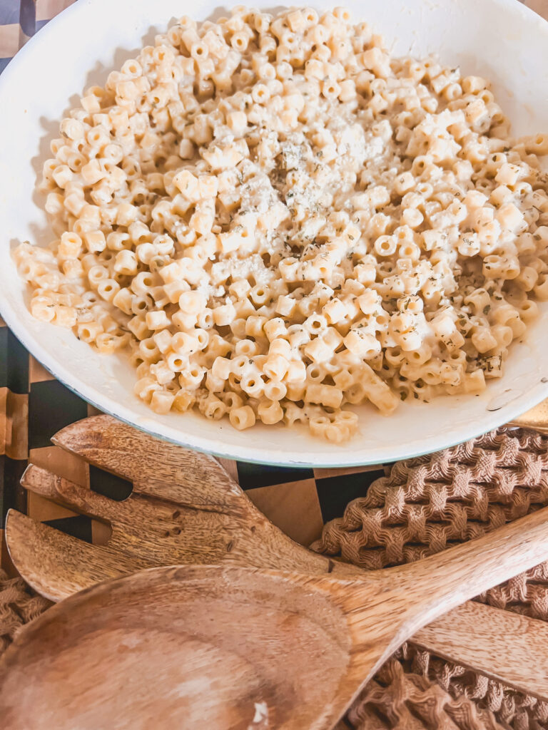 Garlic Pasta in a white bowl with wooden spoons