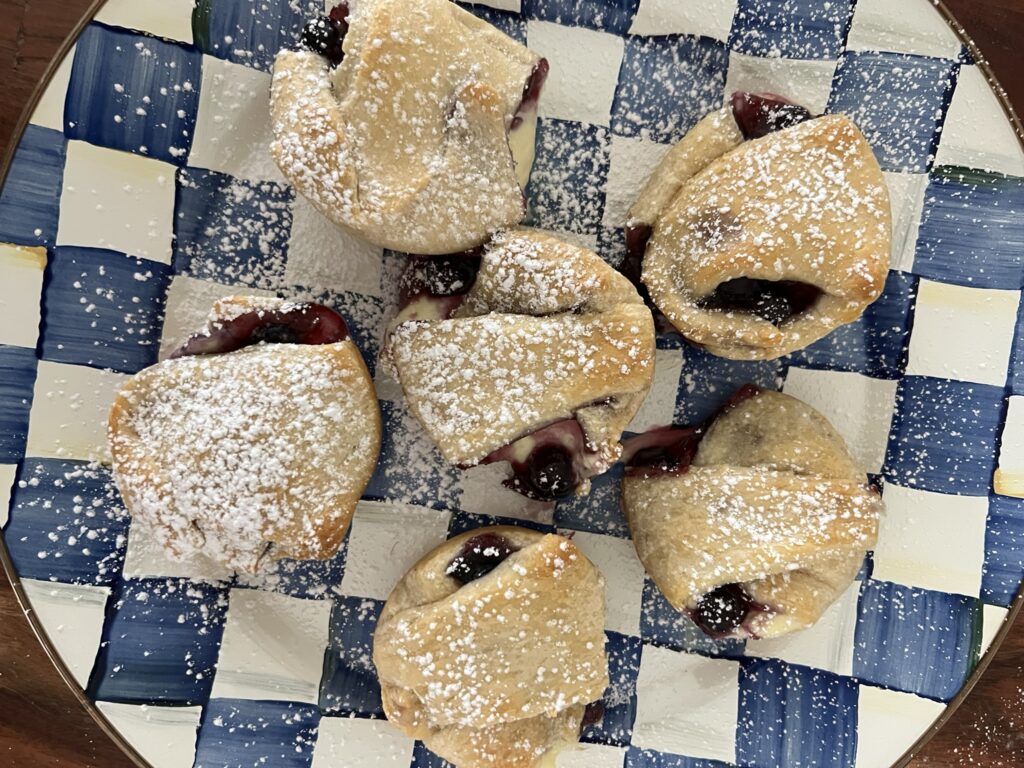 Blueberry and cheesecake bites sprinkled with powdered sugar