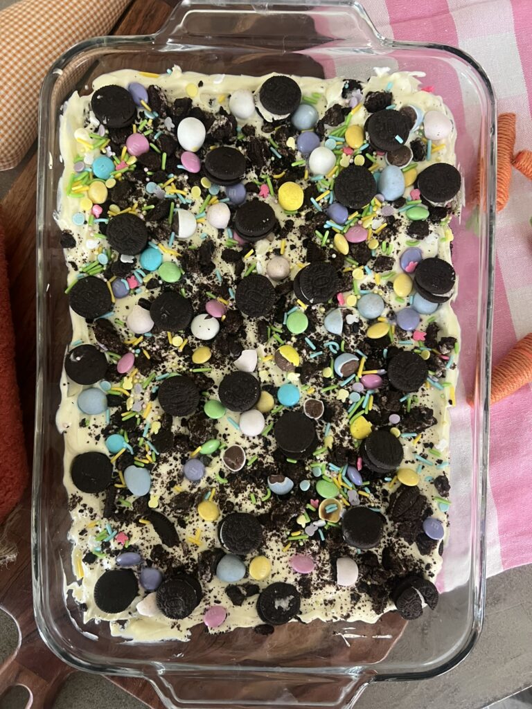 Easter Dirt Cake Casserole covered with Oreos and candies