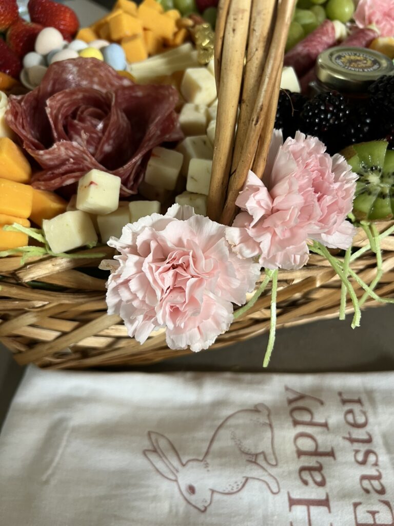 Easter Charcuterie Basket decorated with flowers