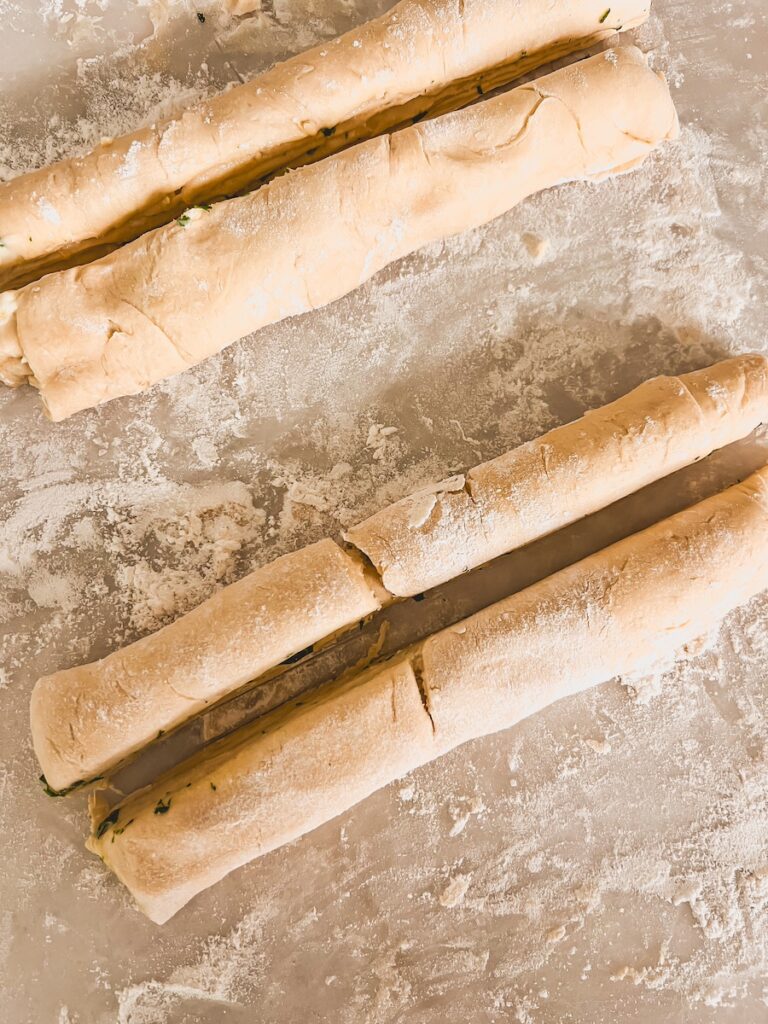 rolled crescent dough on floured surface