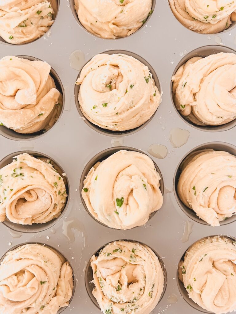 close up of dough not baked in muffin tin