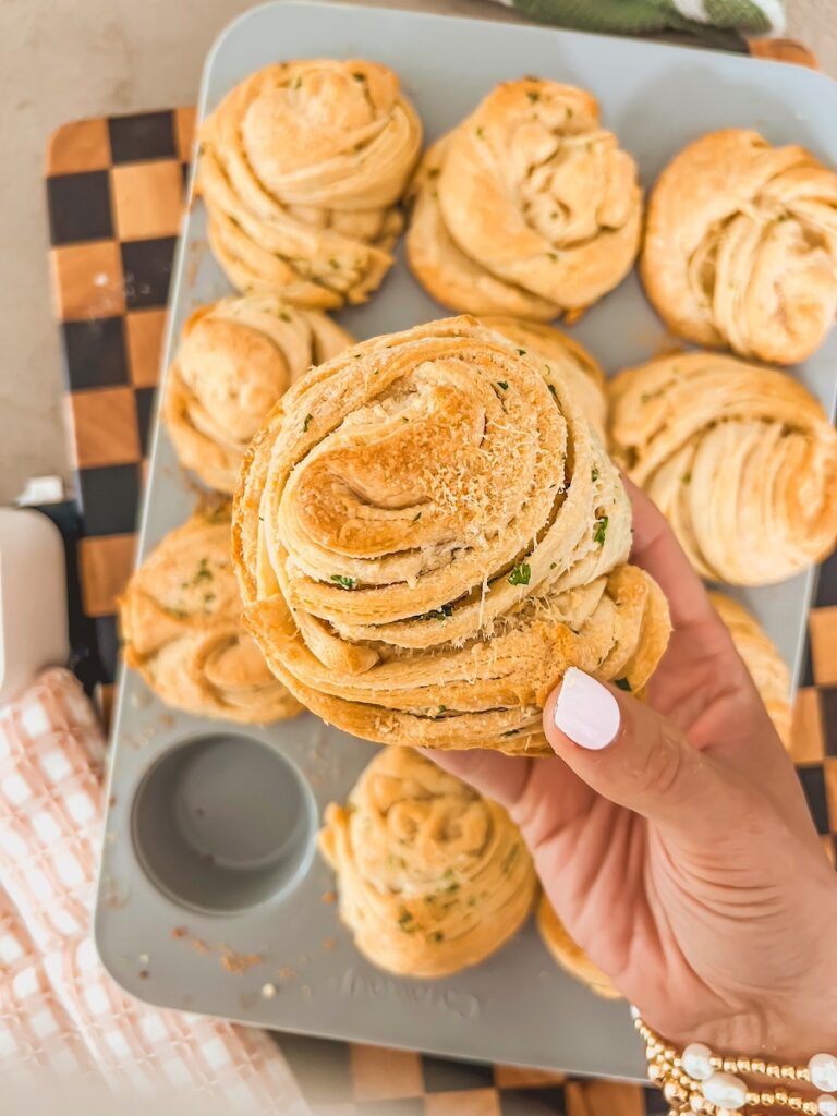 hand holding garlic parmesan cruffin