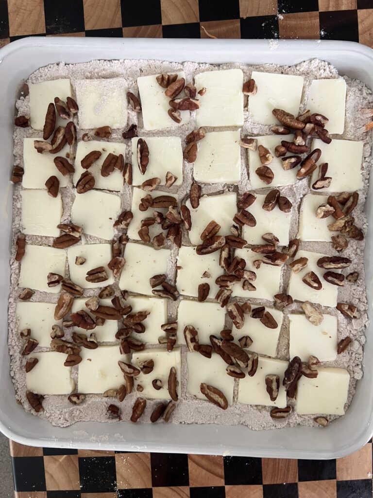 Cubed cream cheese with pecans for icing
