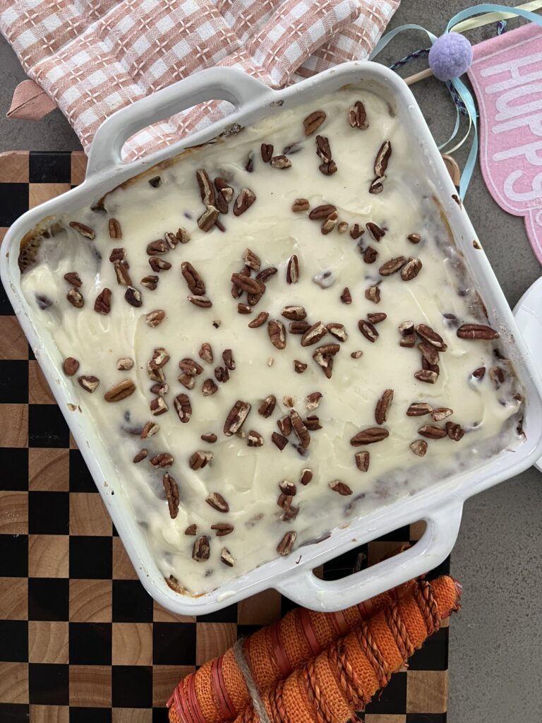 Dump and Bake Carrot Cake topped with icing and pecans