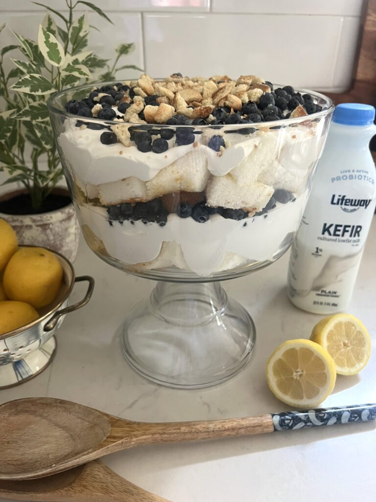 Lemon Blueberry Trifle with a bowl of lemons