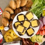 Build-Your-Own Burger Bar with buns, cheese, and toppings