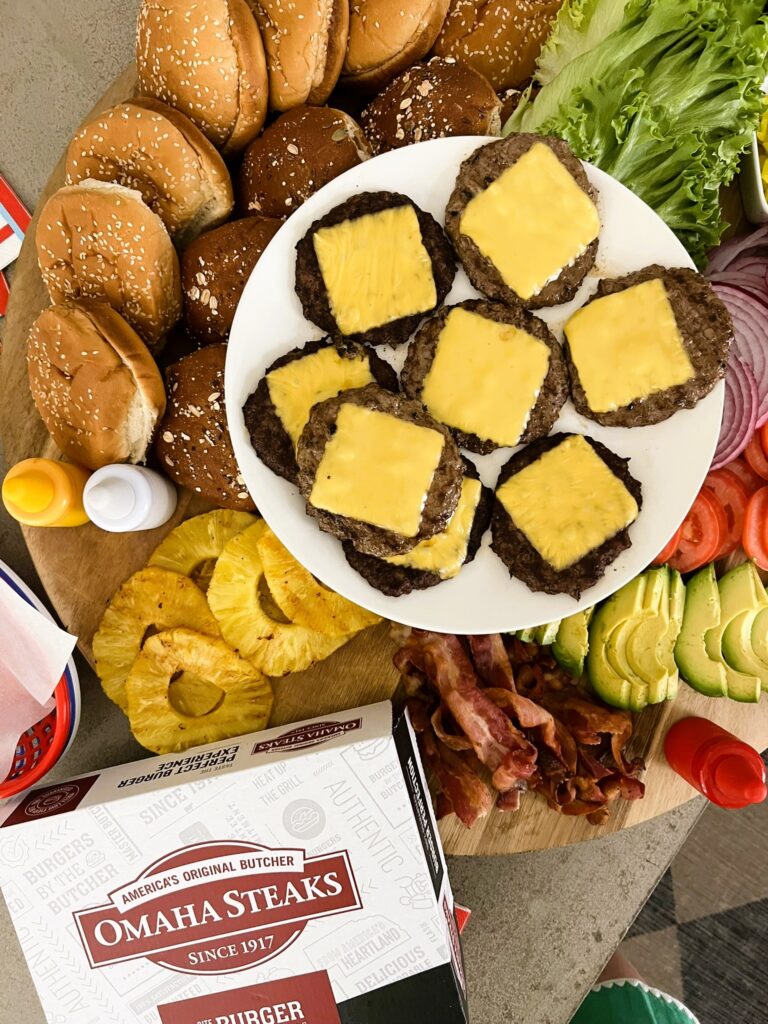 Burger Food Board surrounded by toppings